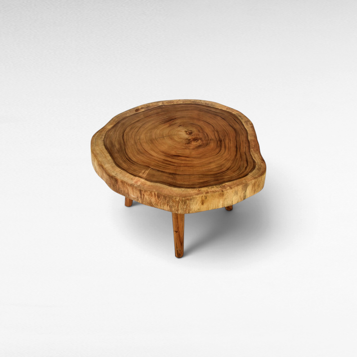 Chora Barefoot Luxury Living round live edge wood coffee table with natural grain and three sturdy wooden legs