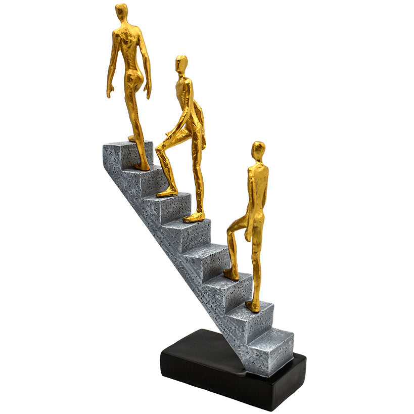 3 GOLD FIGURINES ON STAIRS