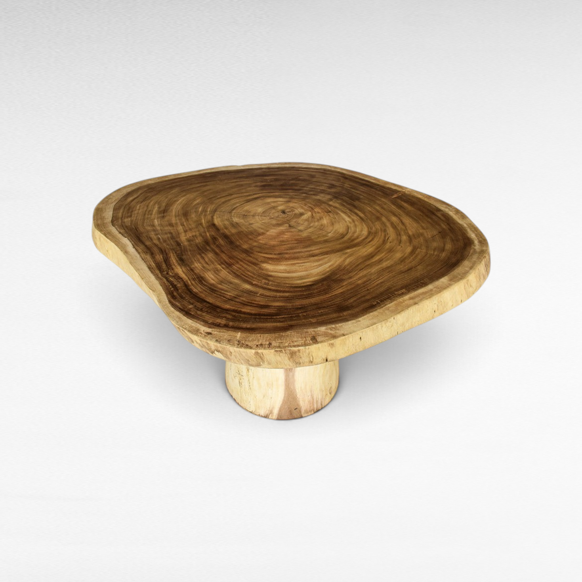 Chora Barefoot Luxury Living natural suar wood dining table with a live edge circular slab top and pedestal base