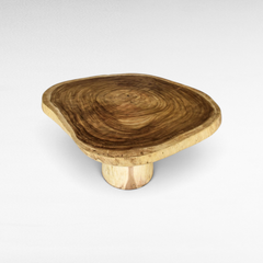 Chora Barefoot Luxury Living natural suar wood dining table with a live edge circular slab top and pedestal base