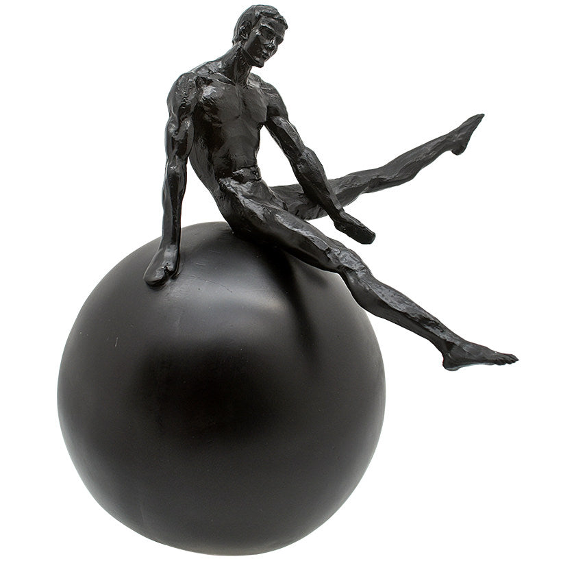 BLACK FIGURINE ON BLACK SPHERE