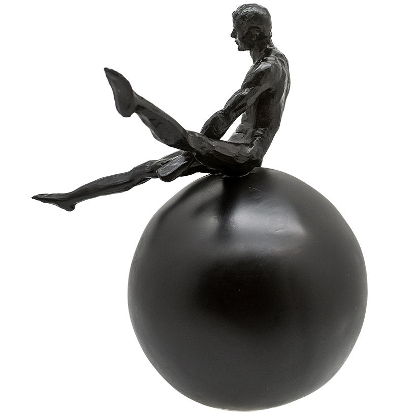 BLACK FIGURINE ON BLACK SPHERE