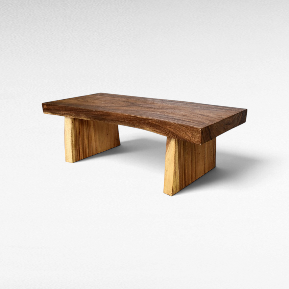 Chora Barefoot Luxury Living rectangular suar wood coffee table with a natural live edge finish