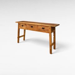 Chora Barefoot Luxury Living rustic teak wood console table with three drawers and black metal hardware