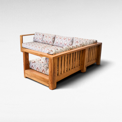 Chora Barefoot Luxury Living teak wood corner sofa with patterned cushions and slatted frame design