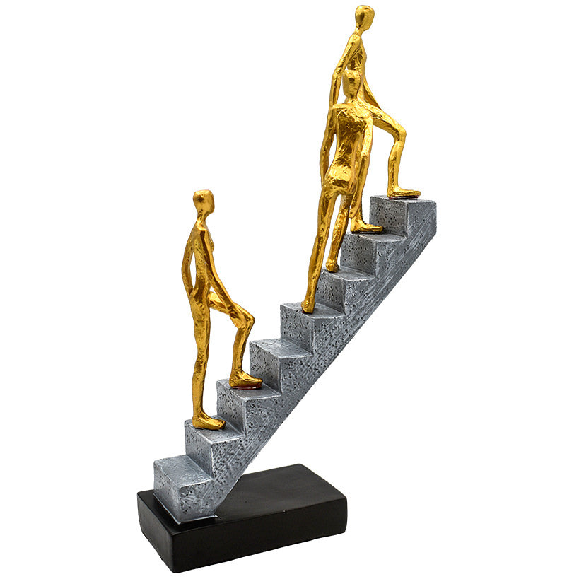 3 GOLD FIGURINES ON STAIRS