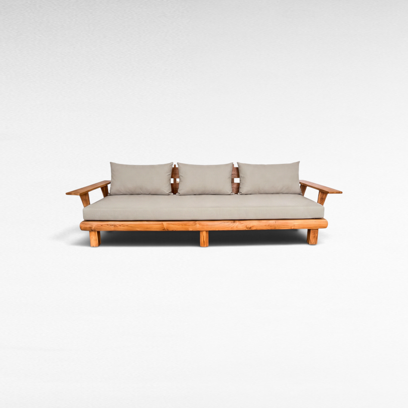 Chora Barefoot Luxury Living teak wood sofa with neutral grey cushions and sturdy wooden armrests