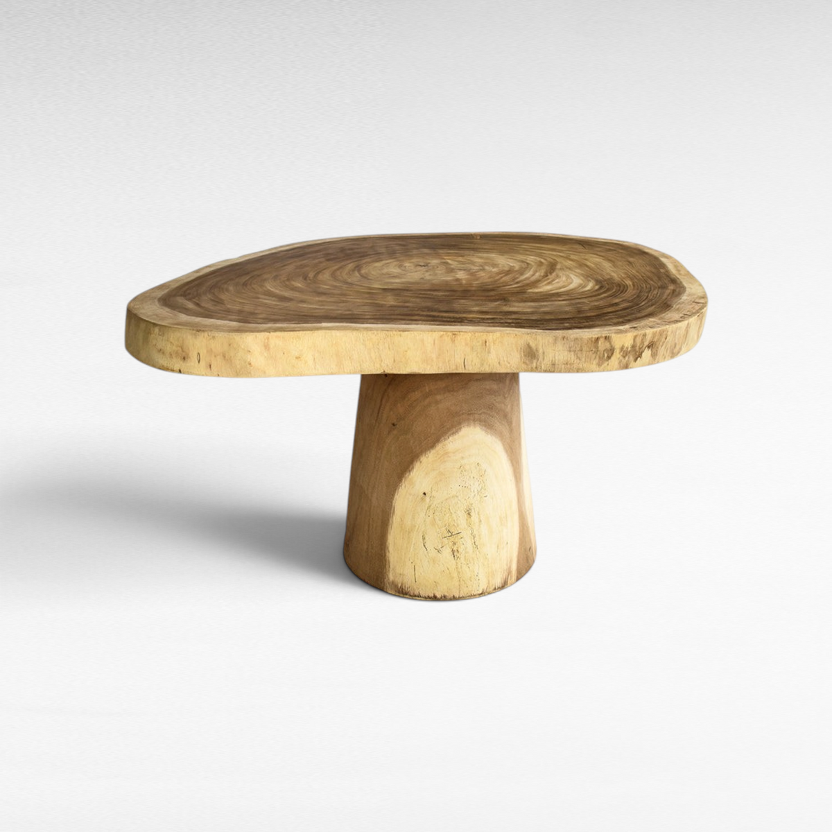 Chora Barefoot Luxury Living live edge suar wood dining table with a thick circular pedestal base