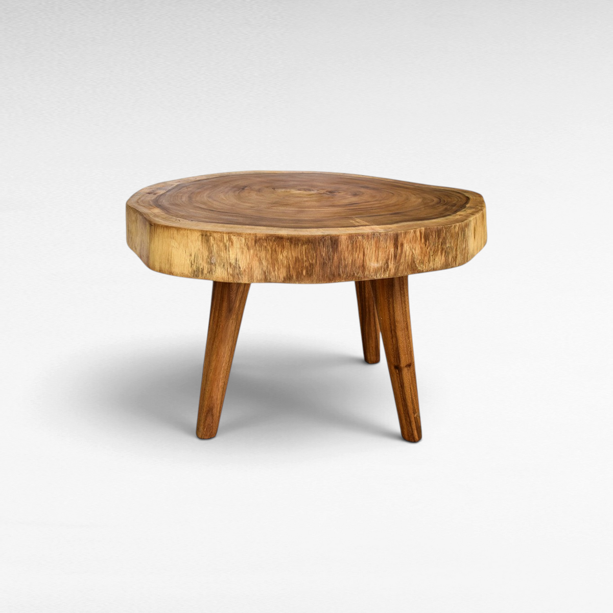 Chora Barefoot Luxury Living round live edge wooden coffee table with natural grain and three tapered legs