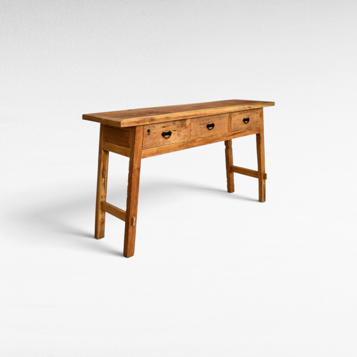 Chora Barefoot Luxury Living rustic teak wood console table featuring three drawers and black metal hardware