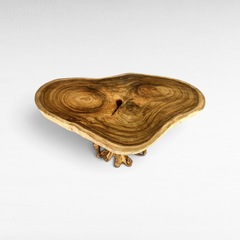 Chora Barefoot Luxury Living Suar wood dining table with a natural live edge slab and sculptural root base.