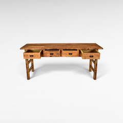 Chora Barefoot Luxury Living rustic reclaimed teak wood console table with four open drawers and natural grain finish.
