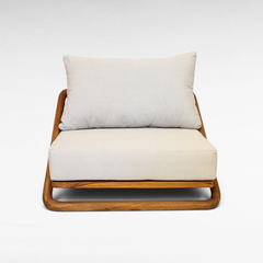 Chora Barefoot Luxury Living teak wood lounge chair with a beige upholstered seat and back cushion