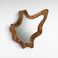 Chora Barefoot Luxury Living unshaped teak wood wall mirror with a natural organic grain finish