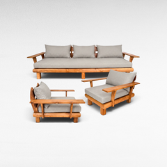 Chora Barefoot Luxury Living teak wood sofa set with three pieces and light grey cushions on a white background