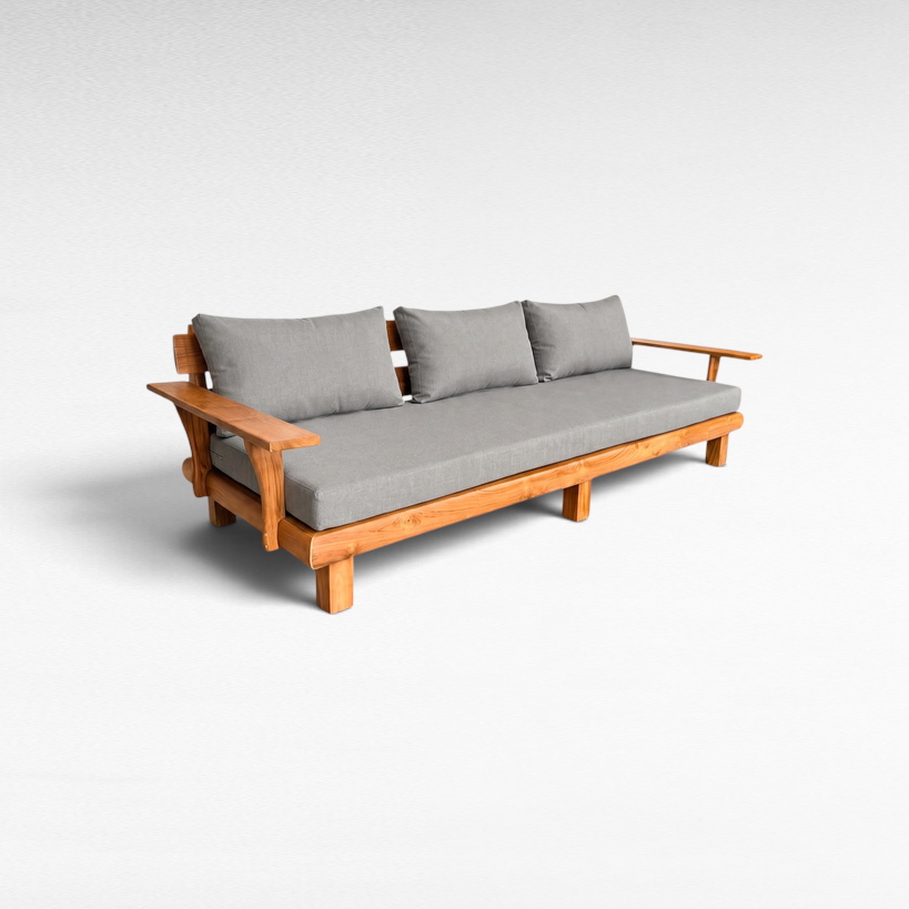 Chora Barefoot Luxury Living teak wood outdoor sofa with grey fabric cushions and natural wooden frame