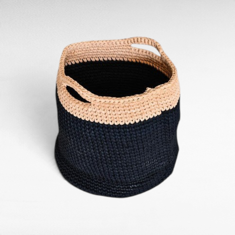 Chora Barefoot Luxury Living handmade cotton basket with a two-tone black and beige woven design and side handles.