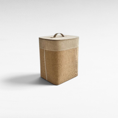 Chora Barefoot Luxury Living beige storage basket with a suede leather lid and textured jute body on a white background