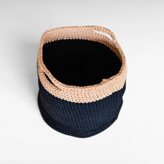Chora Barefoot Luxury Living handmade cotton basket featuring a two-tone black and beige woven design with handles.
