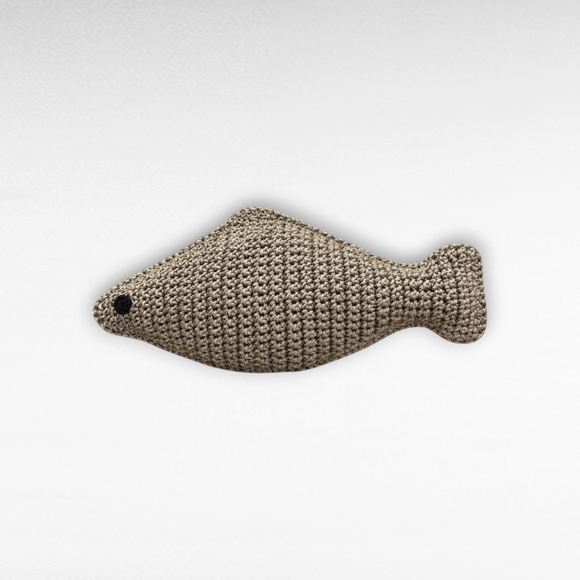 Chora Barefoot Luxury Living small fish-shaped pillow in natural beige crochet knit with a black stitched eye