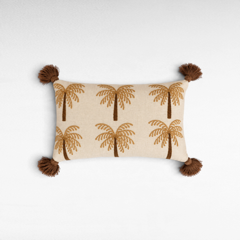 Chora Barefoot Luxury Living rectangular throw pillow with embroidered palm tree pattern and brown corner tassels