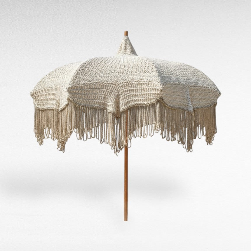 Off-white umbrella with natural rope fringes and wooden pole