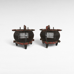 Chora Barefoot Luxury Living antique bird cages with dark wood slats and distressed red and green painted accents.