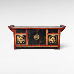 Chora Barefoot Luxury Living antique black and red lacquered buffet with ornate gold detailing and brass hardware.