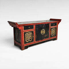 Chora Barefoot Luxury Living antique black and red buffet with ornate gold details and brass hardware