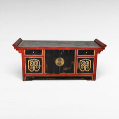 Chora Barefoot Luxury Living antique black and red lacquered buffet with gold ornate details and brass hardware.