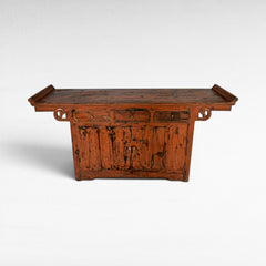 Chora Barefoot Luxury Living antique orange distressed wood buffet with drawers and cabinet doors, ornate scroll details.