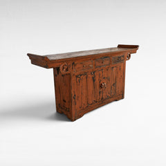 Chora Barefoot Luxury Living antique distressed orange wooden buffet with carved details and three drawers