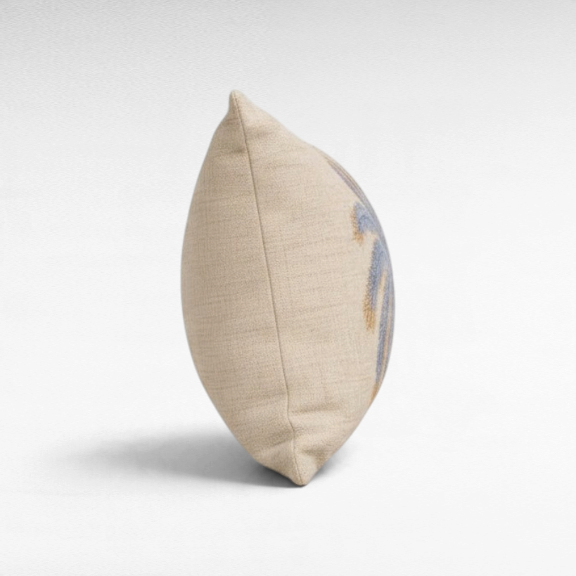 Chora Barefoot Luxury Living beige linen throw pillow with blue palm tree embroidery, side profile view