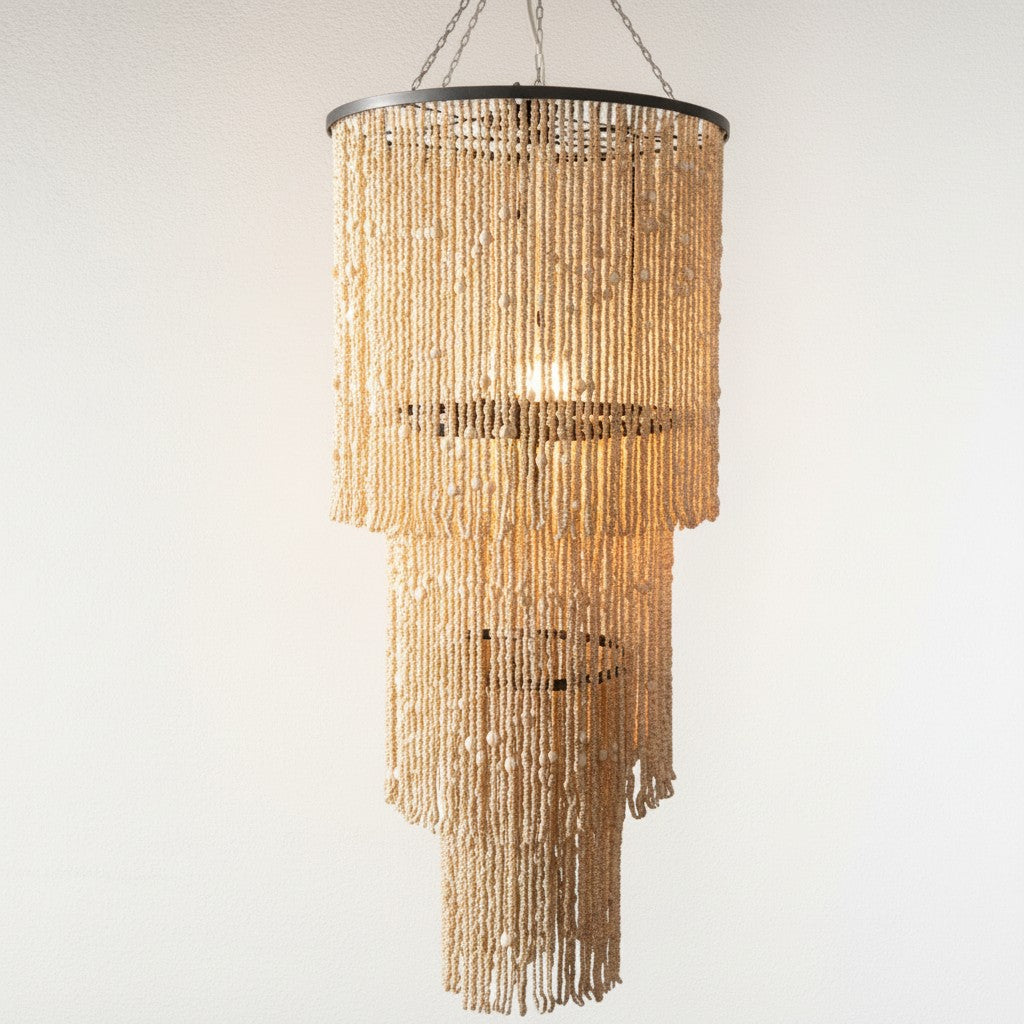 Chora Barefoot Luxury Living oversized tiered chandelier with hundreds of hand-strung bleached wooden beads on a metal frame.