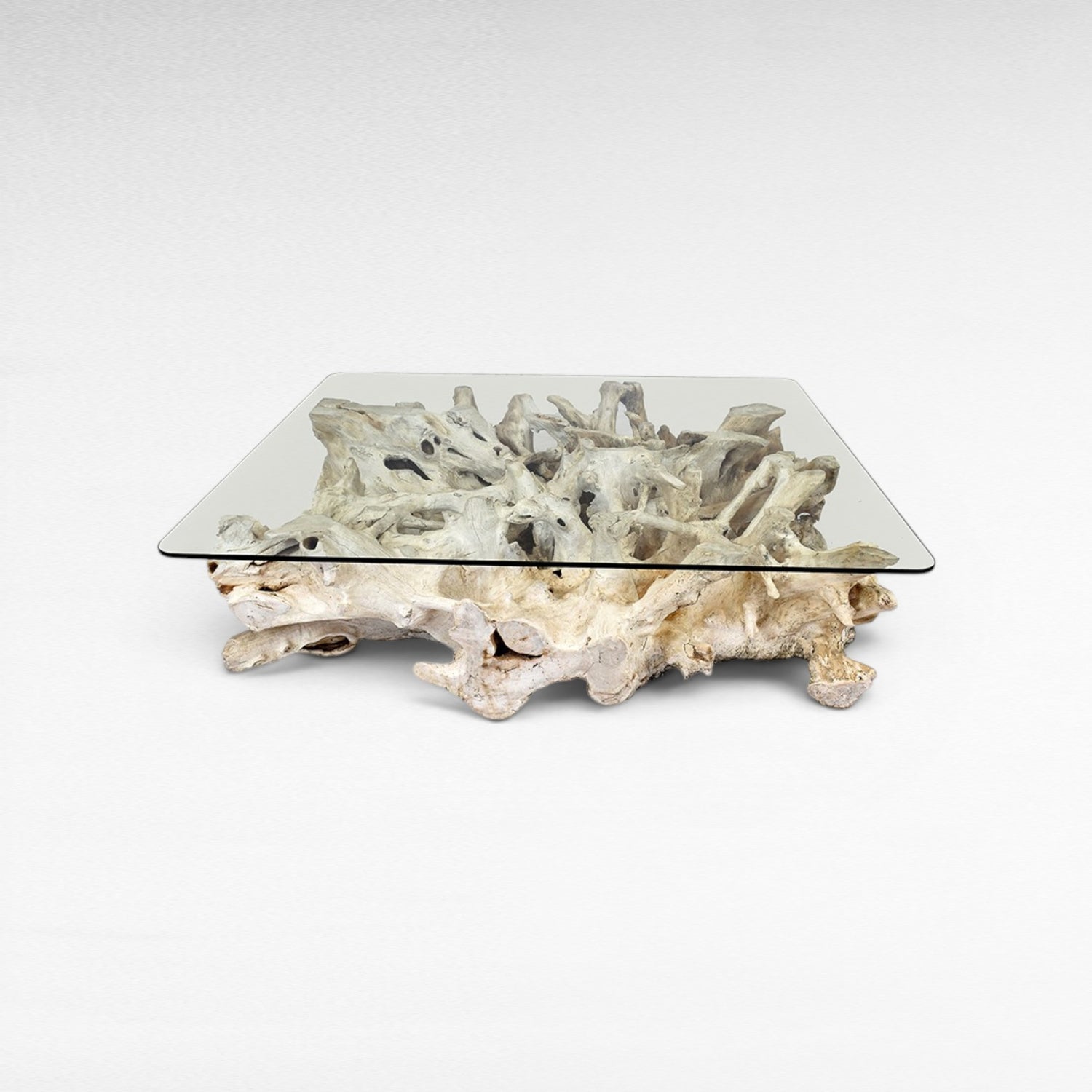 Chora Barefoot Luxury Living bleached driftwood coffee table with clear glass top, W120 D140 H45 cm.