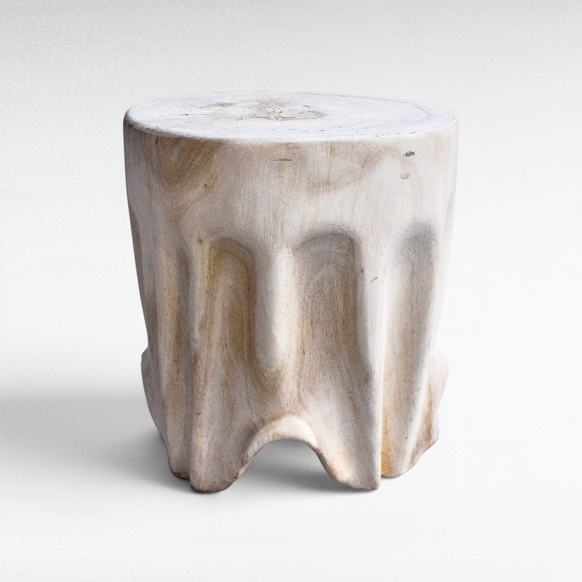 Chora Barefoot Luxury Living bleached suar wood stool with a unique organic carved base and natural grain texture.