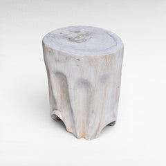 Chora Barefoot Luxury Living bleached suar wood stool with a natural tree trunk design and organic sculpted base.