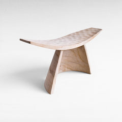 Chora Barefoot Luxury Living bleached suar wood stool with a curved seat and minimalist sculptural design