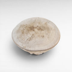 Chora Barefoot Luxury Living bleached suar wood stool with a natural circular tree slice top and visible wood grain