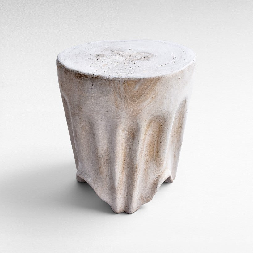 Chora Barefoot Luxury Living bleached suar wood stool with a natural organic carved base and smooth round top.