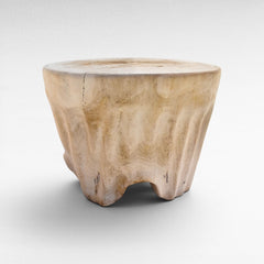 Chora Barefoot Luxury Living bleached suar wood stool with a natural organic shape and smooth circular top.