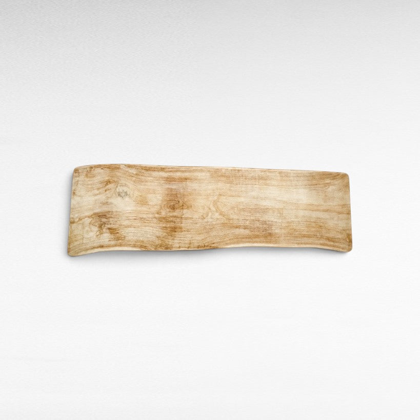 Chora Barefoot Luxury Living bleached suar wood dining table with natural grain, top-down view on white background
