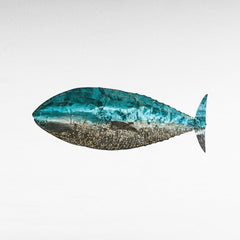 Chora Barefoot Luxury Living blue and silver fish wall lamp with textured finish and gold accents, casting a warm glow.