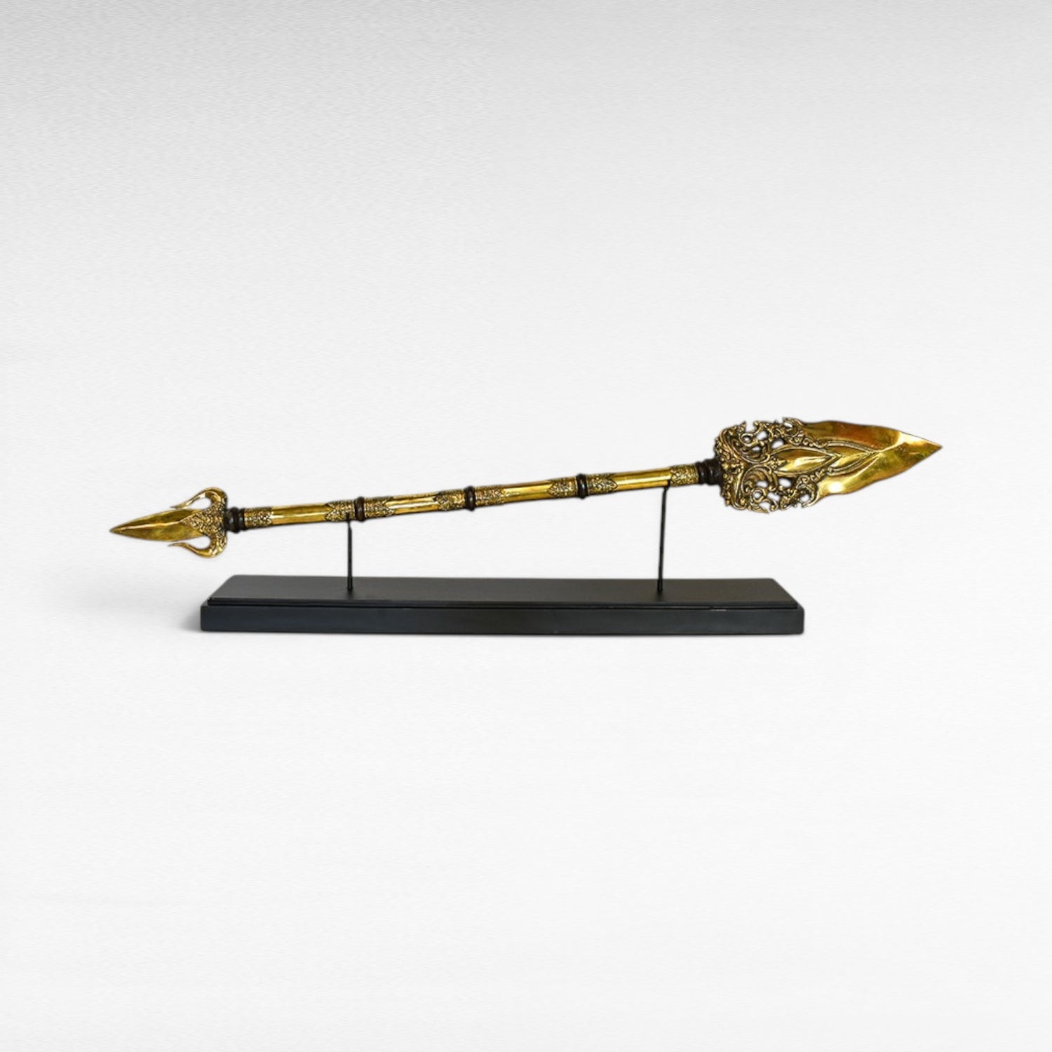 Chora Barefoot Luxury Living ornate brass golden spear with decorative shaft and stand