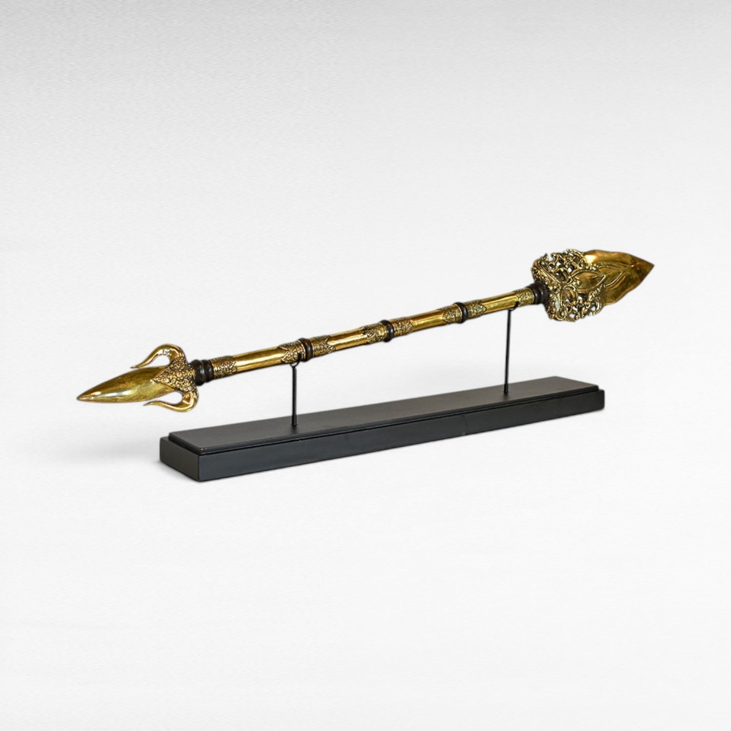 Chora Barefoot Luxury Living brass golden sword with ornate detailing and a black display stand.
