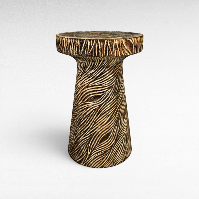 Chora Barefoot Luxury Living carved wood side table with textured wavy pattern, natural wood finish.
