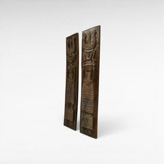 Chora Barefoot Luxury Living set of two carved wooden statues, man and woman figures, 210cm tall, with intricate tribal patterns.