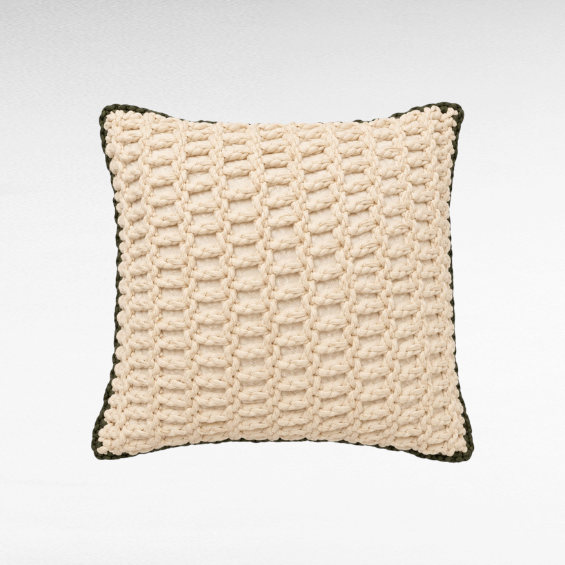Chora Barefoot Luxury Living square cotton rope pillow in cream with a dark green braided border.