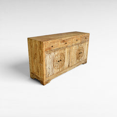 Chora Barefoot Luxury Living distressed wood buffet with carved circular panels and brass knobs. Features 4 drawers and 2 cabinet doors.