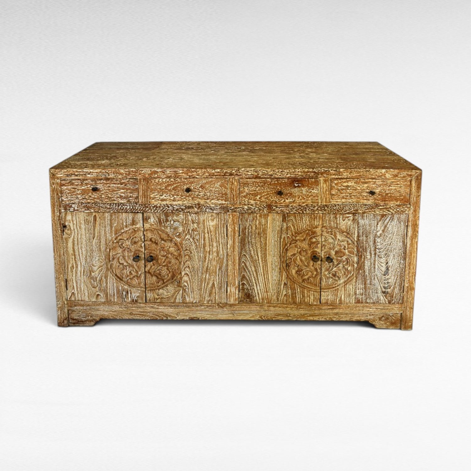 Chora Barefoot Luxury Living distressed wood buffet with carved circular motifs on doors and six drawers above.